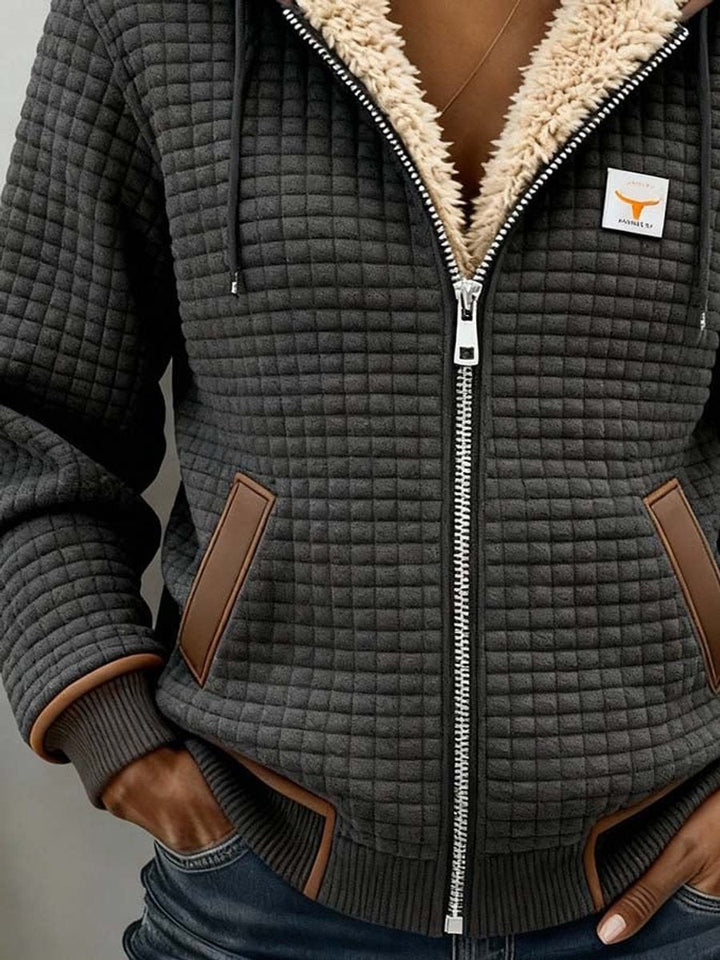 Sandra | Giacca trapuntata con cappuccio, fodera in sherpa e chiusura con zip